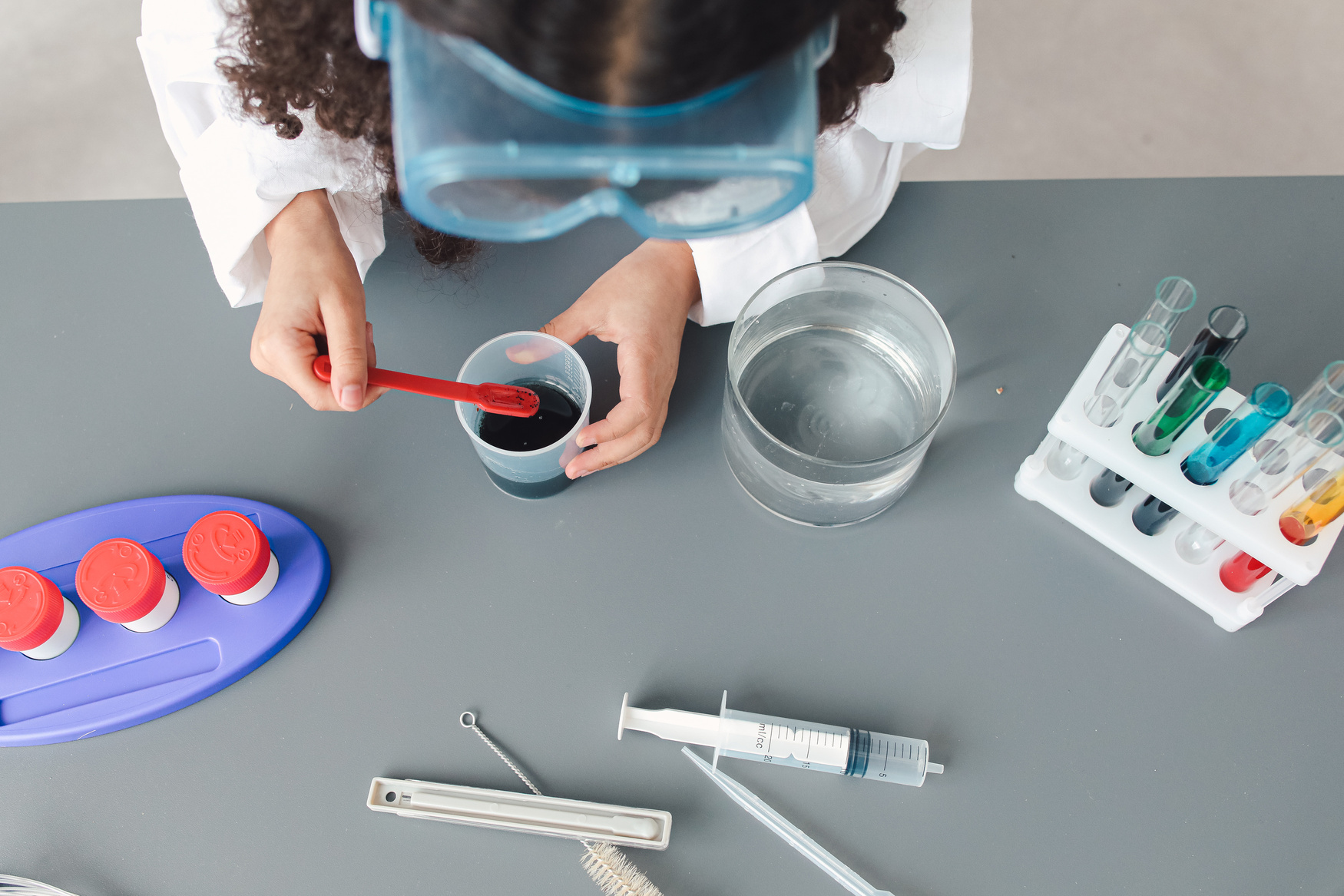 Girl Doing Science Experiment with Dyes